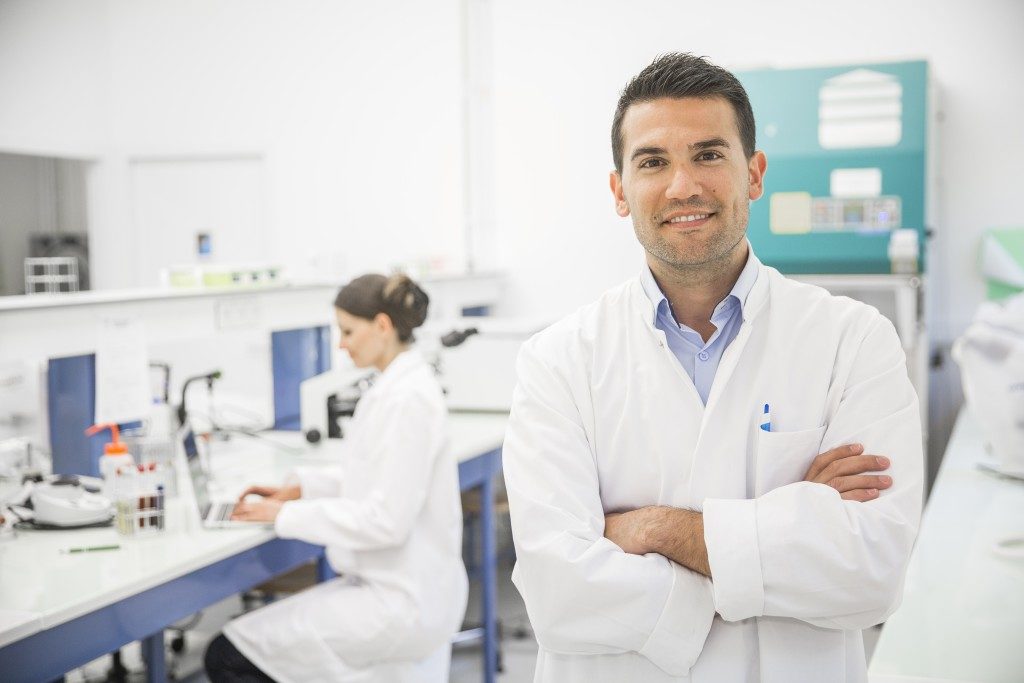 Male scientist posing with his arms crossed
