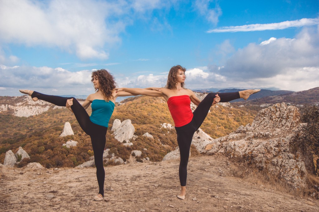 two girls doing yoga